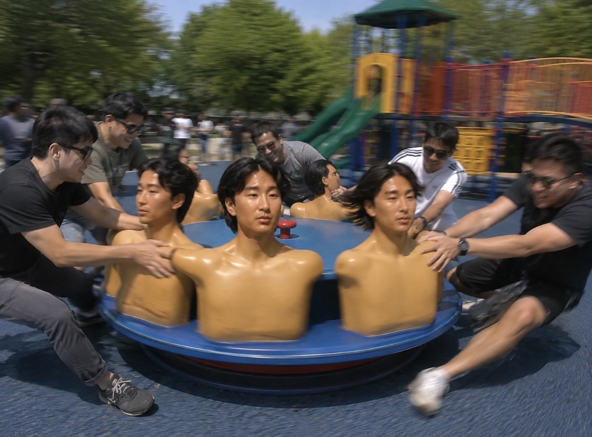 A roundabout of Se Yong Park torsos spun by adults